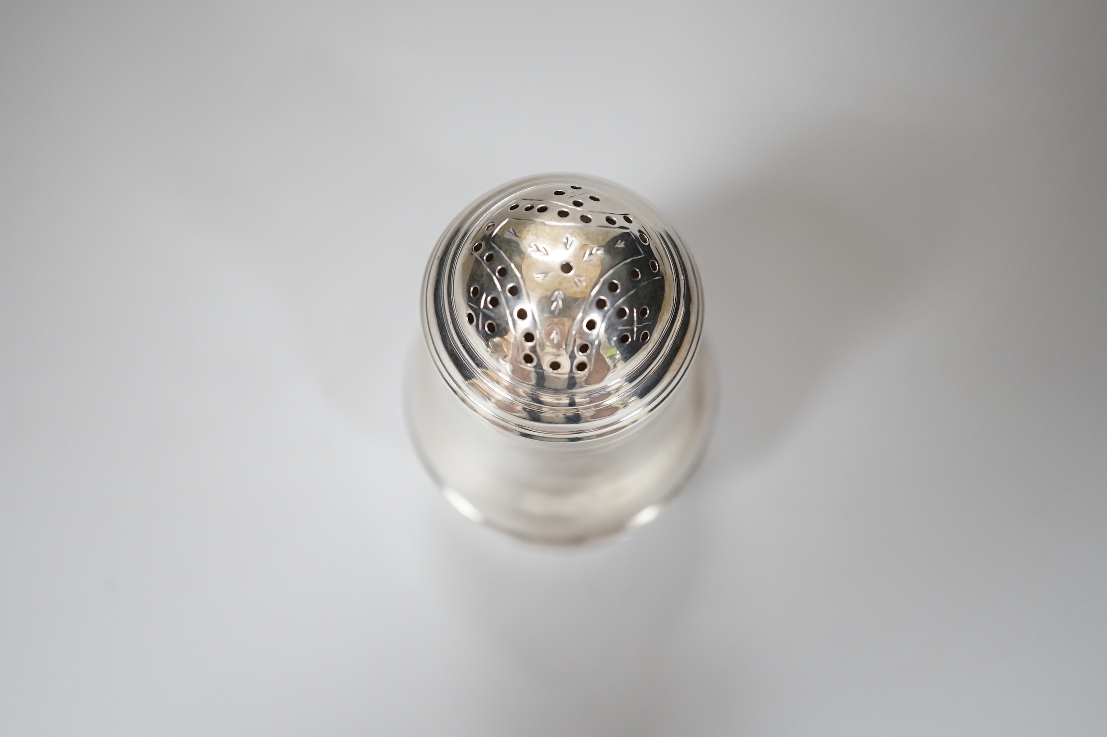 A George I Britannia standard silver baluster muffineer, makers mark rubbed, London 1721, 8.5cm, 72 grams
